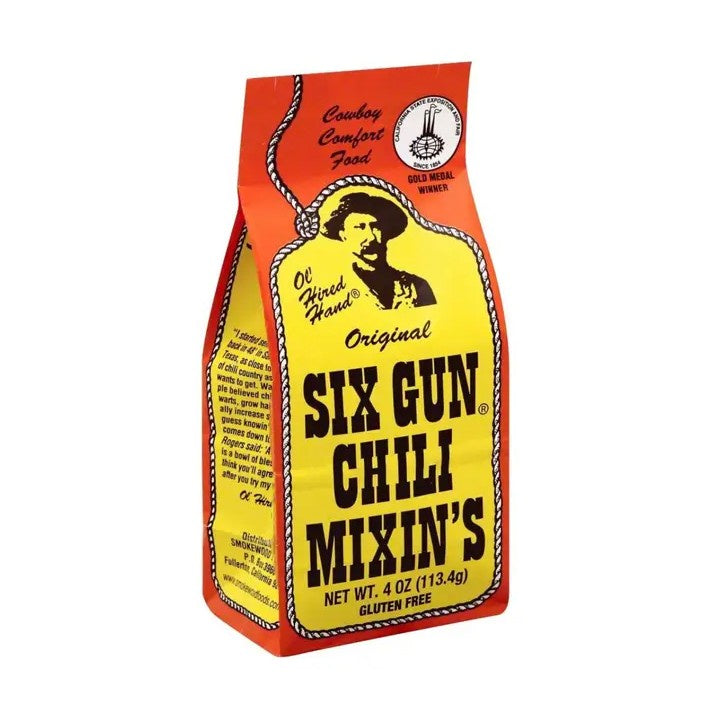 Bag of Six Gun Chili Mixin's with cowboy graphic on a white background
