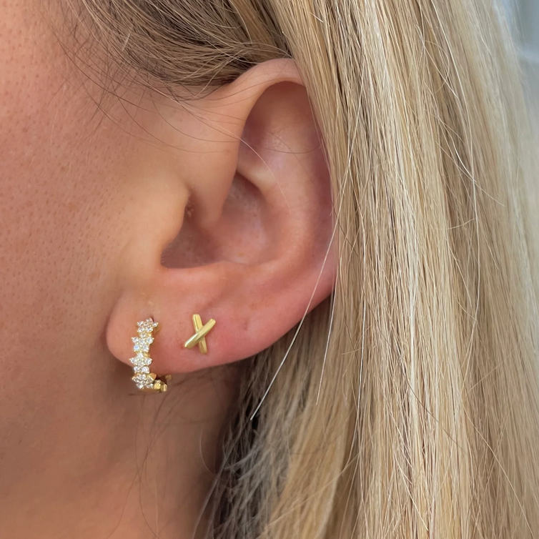 Model wearing crystal huggie earrings