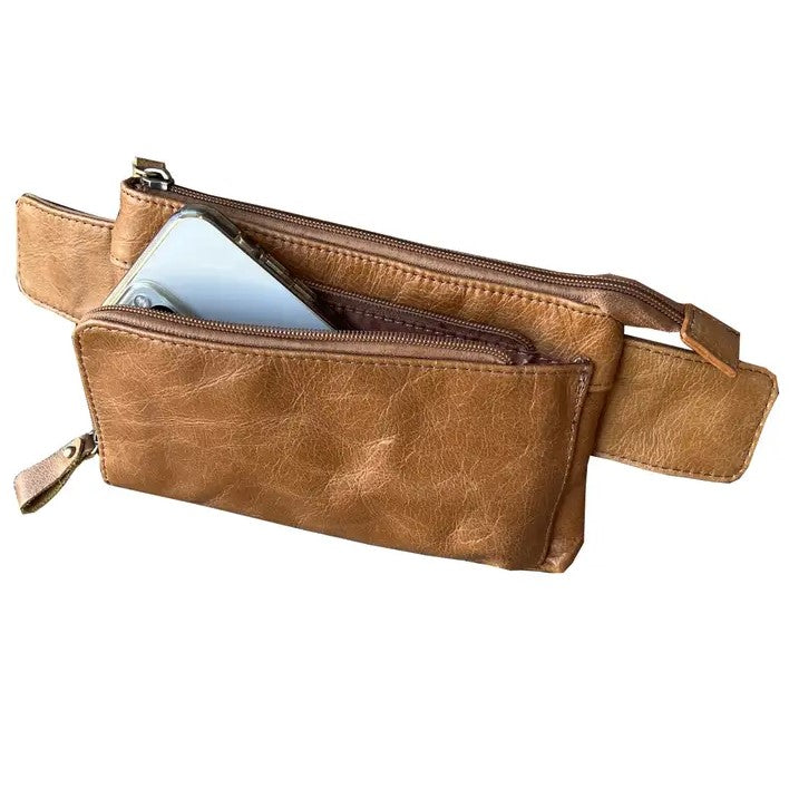 Closeup of phone holding compartment in tan leather fanny pack.