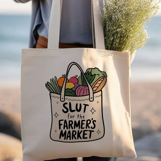 Tote bag with an image of a smaller tote bag full of vegetables and the words "Slut for the farmer's market" on it
