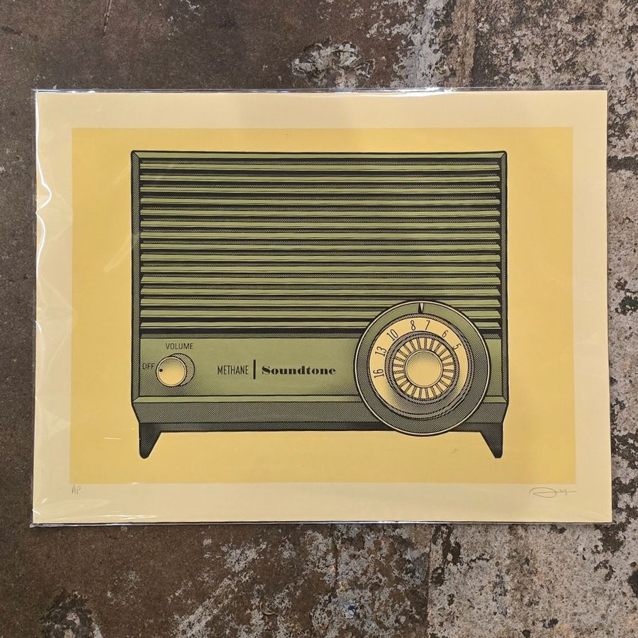 A yellow vintage-style art print depicting an old fashioned radio with a dial 