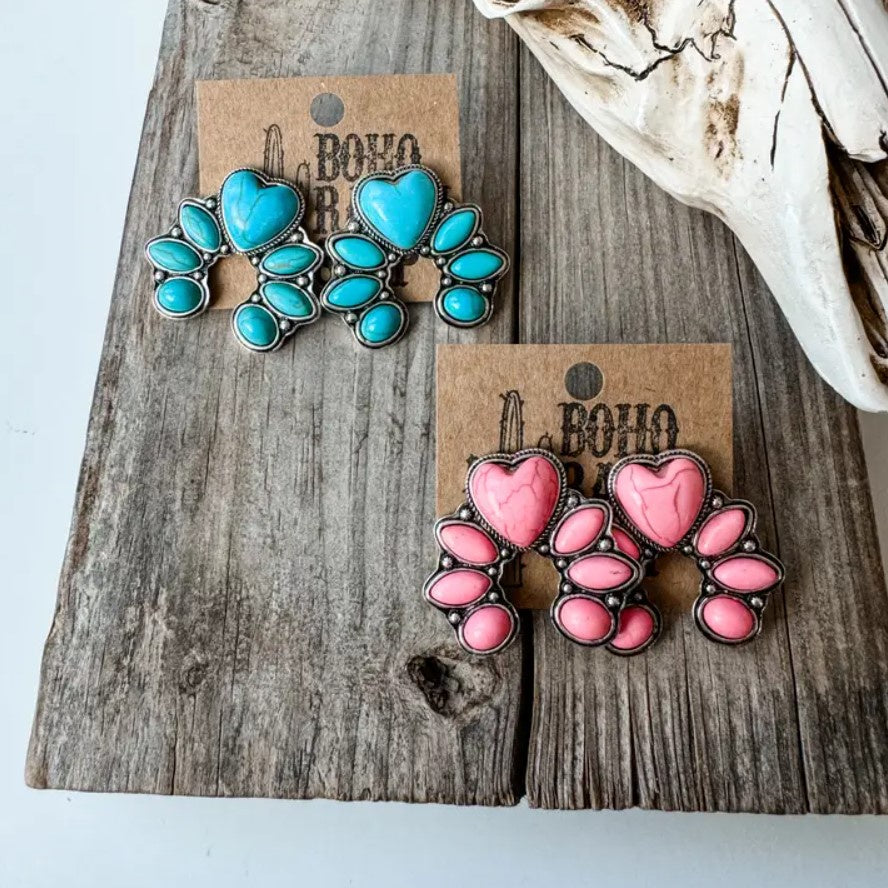Heart-shaped earrings available in turquoise or pink stones 