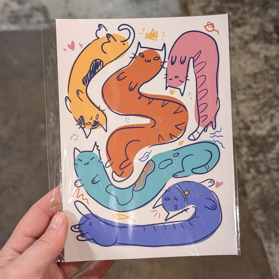 Multiple long cats in various colors on a print