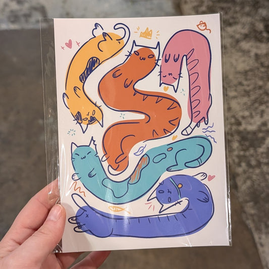 Multiple long cats in various colors on a print