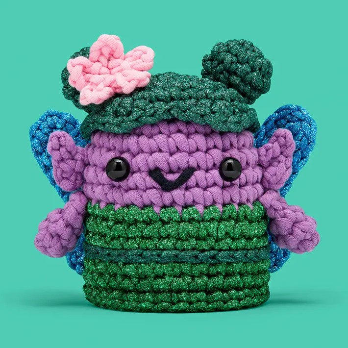 Pink and green crocheted fairy creature