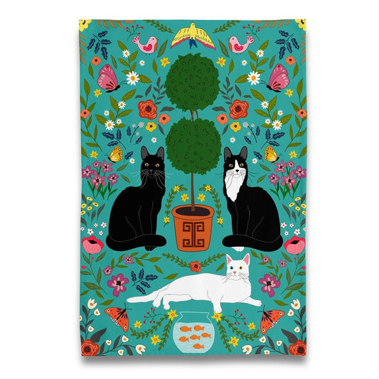 Colorful illustration of three cats sitting by a potted tree surrounded by colorful flowers and birds