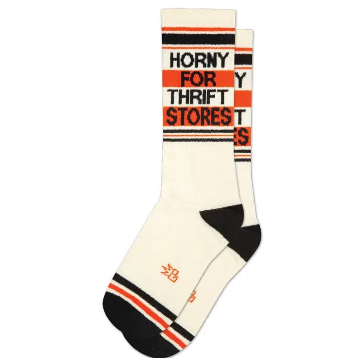 Pair of white, orange and black striped calf socks with the words "Horny for Thrift Stores" printed at the top.