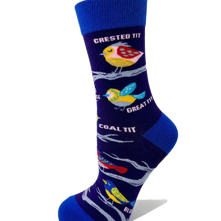 A blue pair of calf socks depicting different species of the "tit" family of birds in a graphic colorful style.