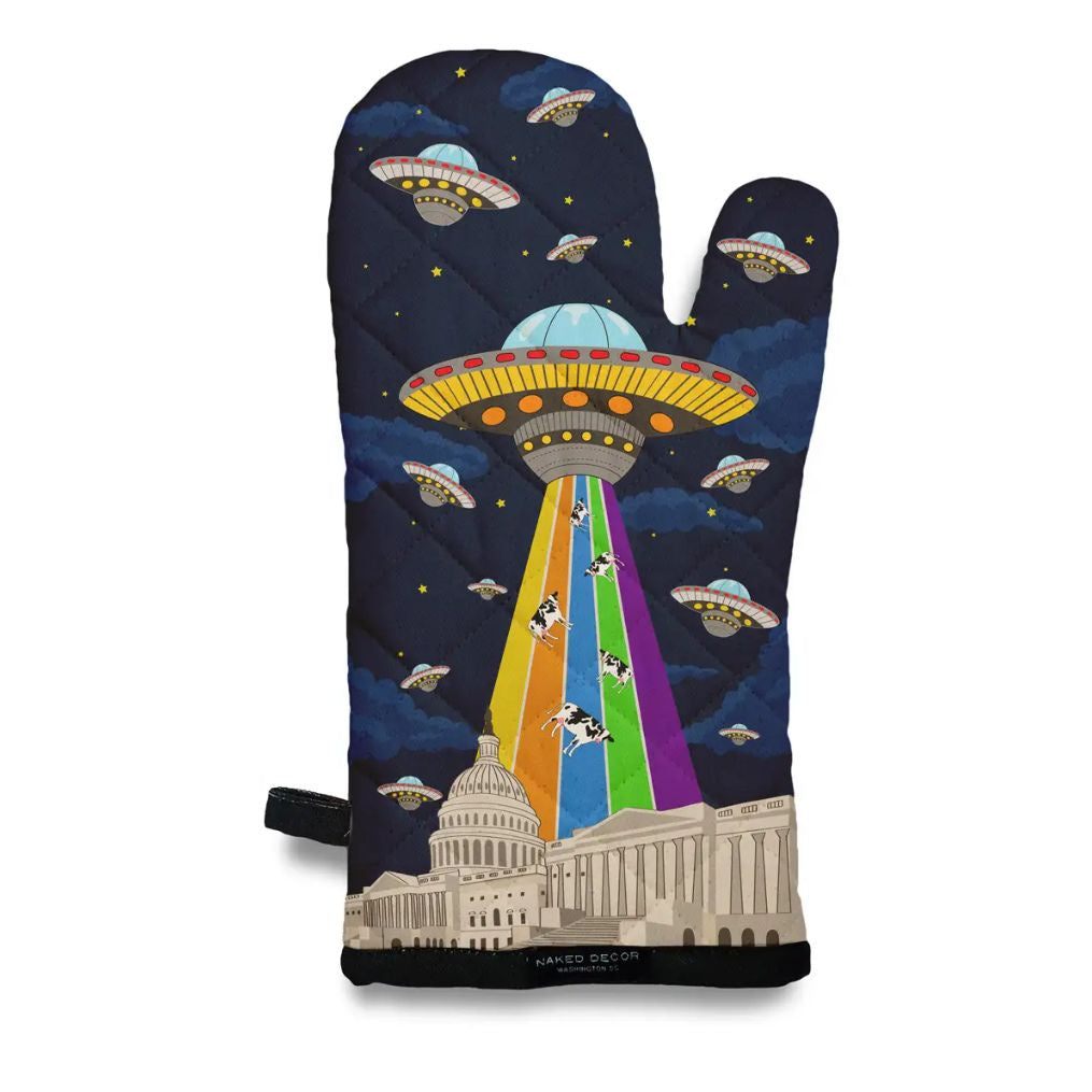 Oven mitt featuring a design of a UFO with a rainbow colored tractor beam and several cows being abducted