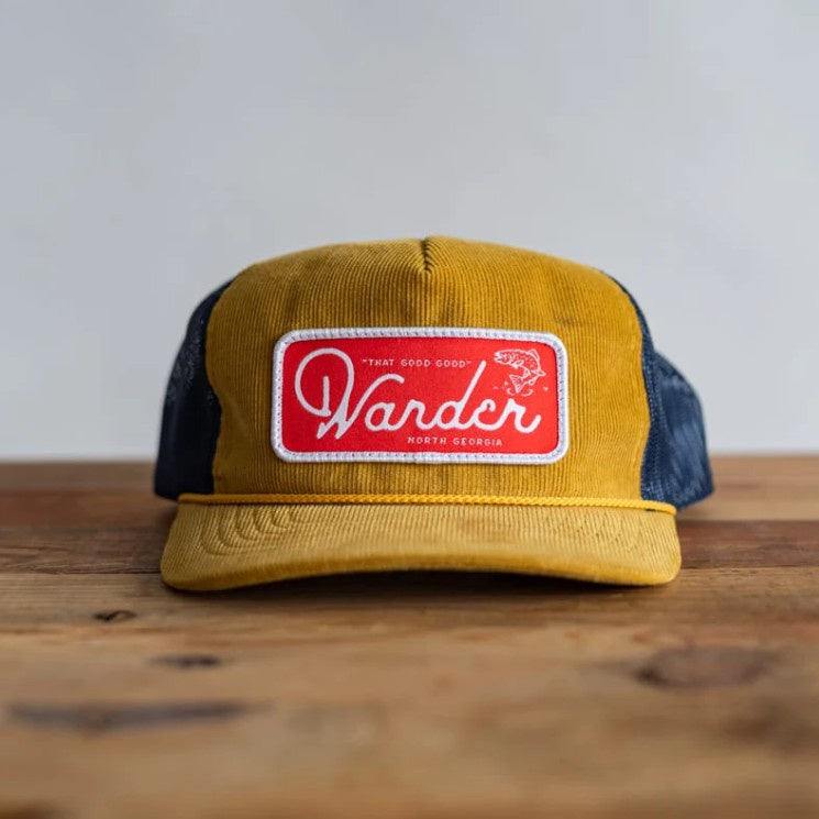 Yellow and blue ball cap with red fabric patch that reads "Wander North Georgia"