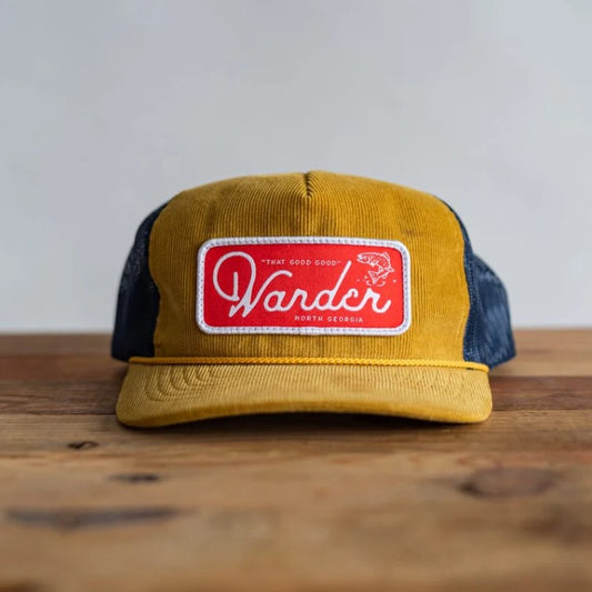 Yellow and blue ball cap with red fabric patch that reads "Wander North Georgia"