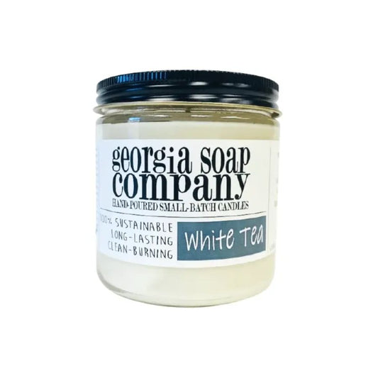 A glass jar candle from Georgia Soap Company in the scent "White Tea"