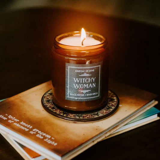 lit witchy woman candle