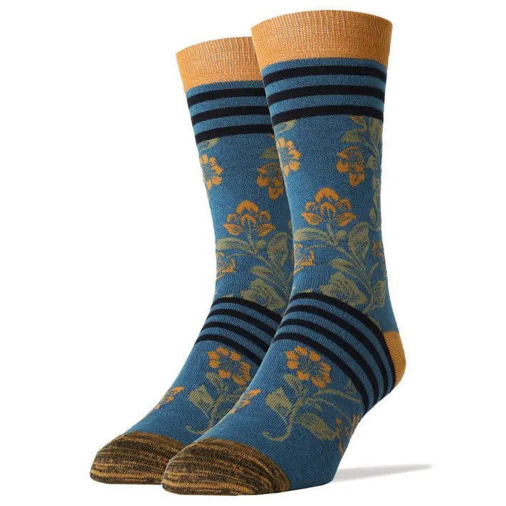 Blue calf socks with a delicate yellow flower print and black bands around the foot and top of the sock.