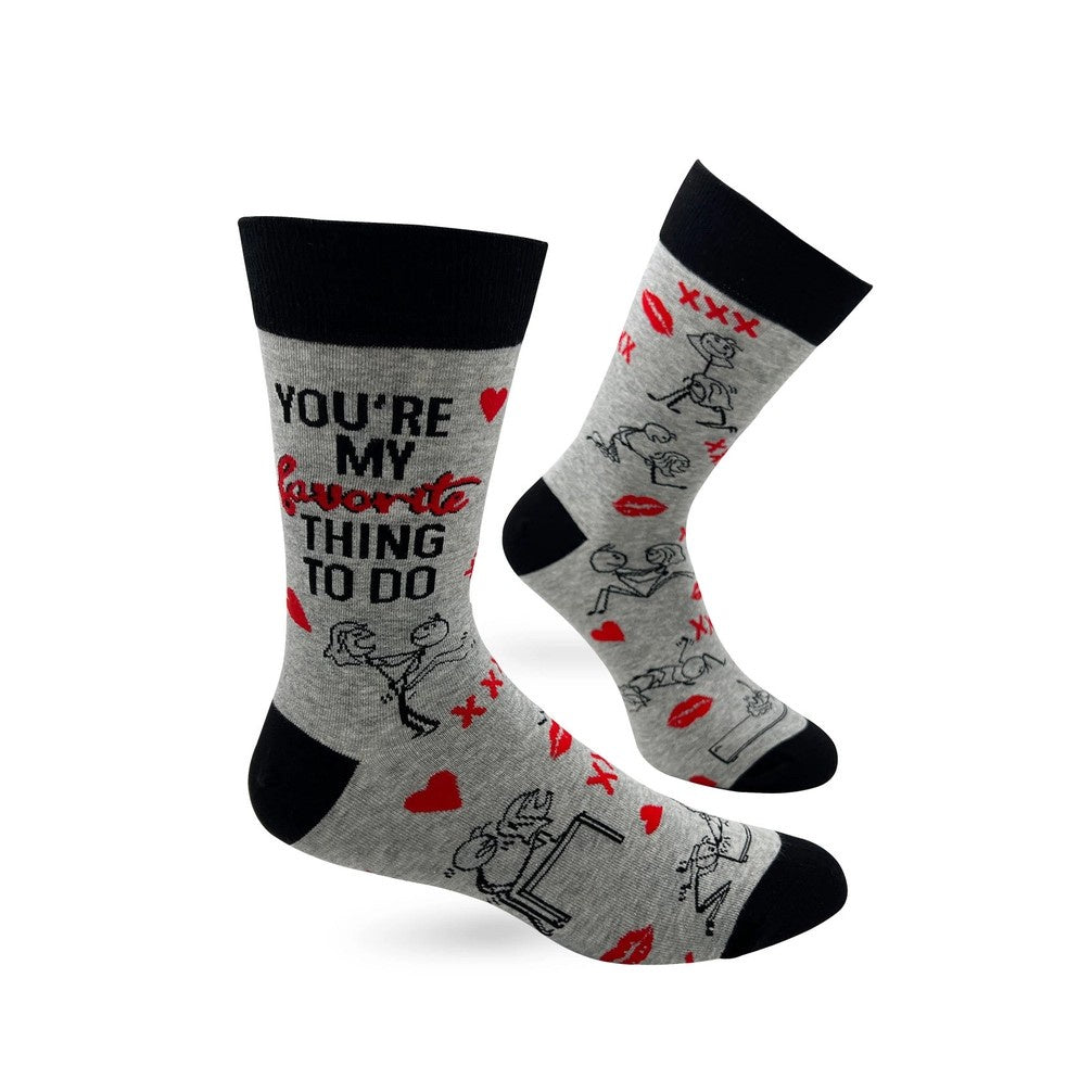 Gray socks with a pattern of stick figures having sex and the words "You're my favorite thing to do"