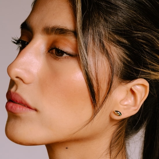 model wearing opal oval marquise post earrings 