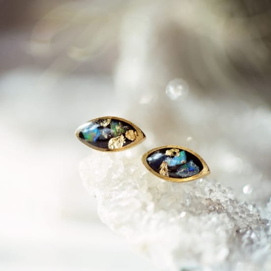 opal oval post earrings on a geode