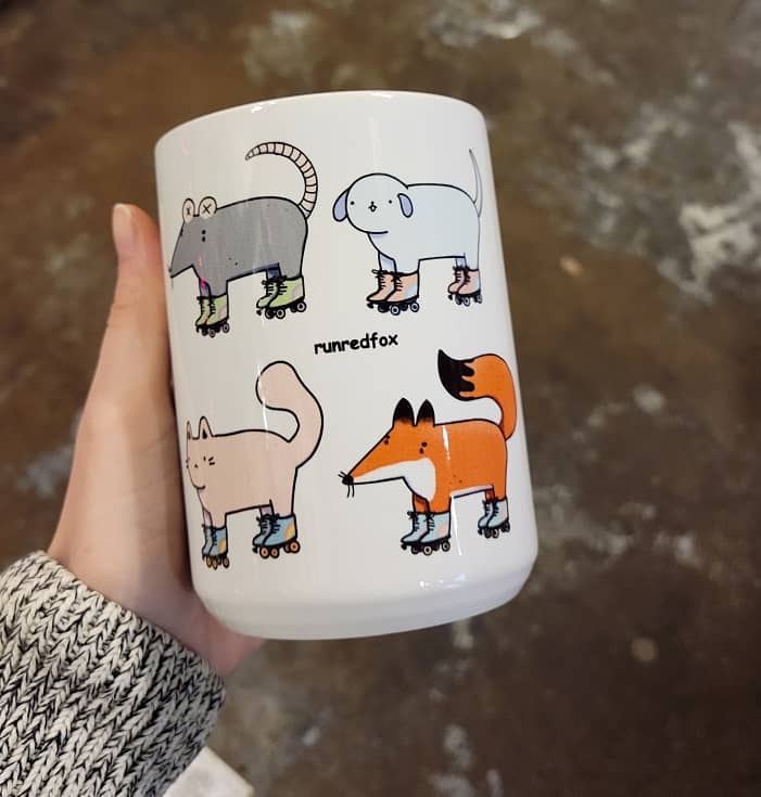 mug with four animals wearing roller skates