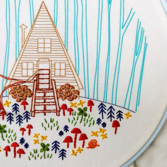 cabin and flowers embroidery diy in progress