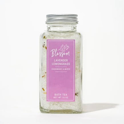 Clear Bottle holding lavender lemongrass bath salts