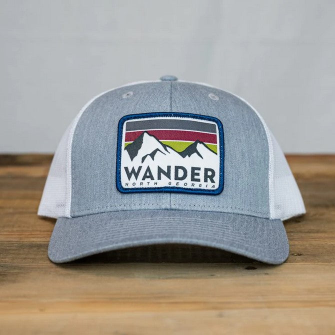Grey hat with embroidered patch that says Wander North Georgia and mountains