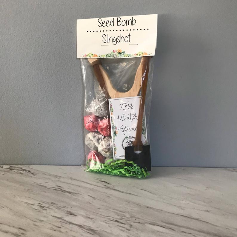 seed bombs packaging with a slingshot